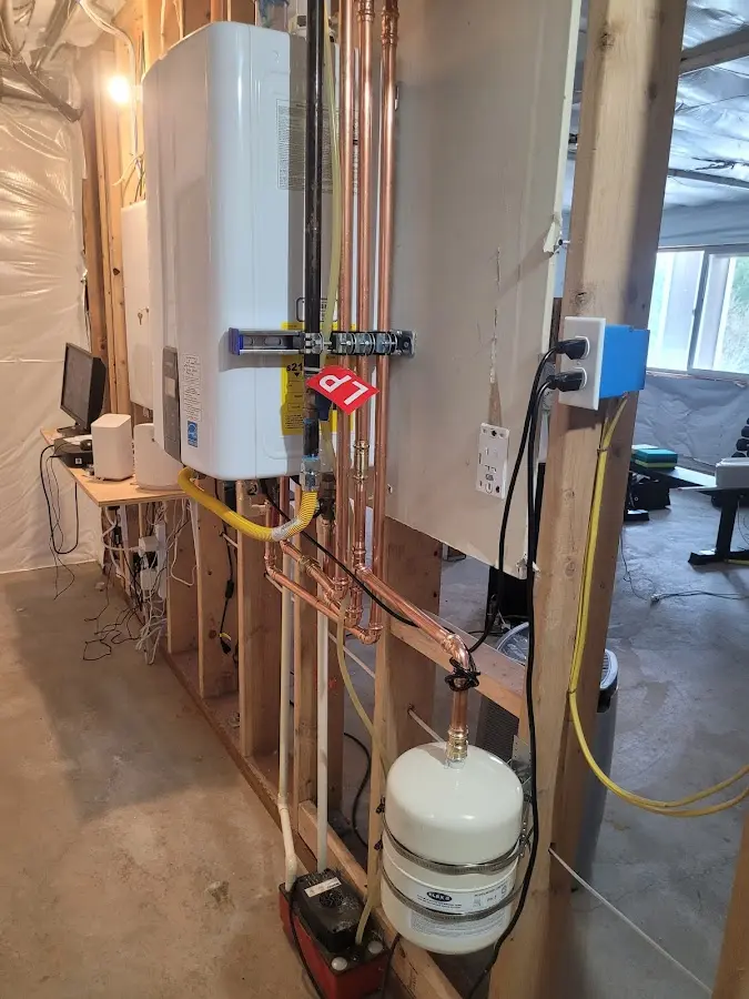 Licensed plumber repairing a kitchen sink in Pompey